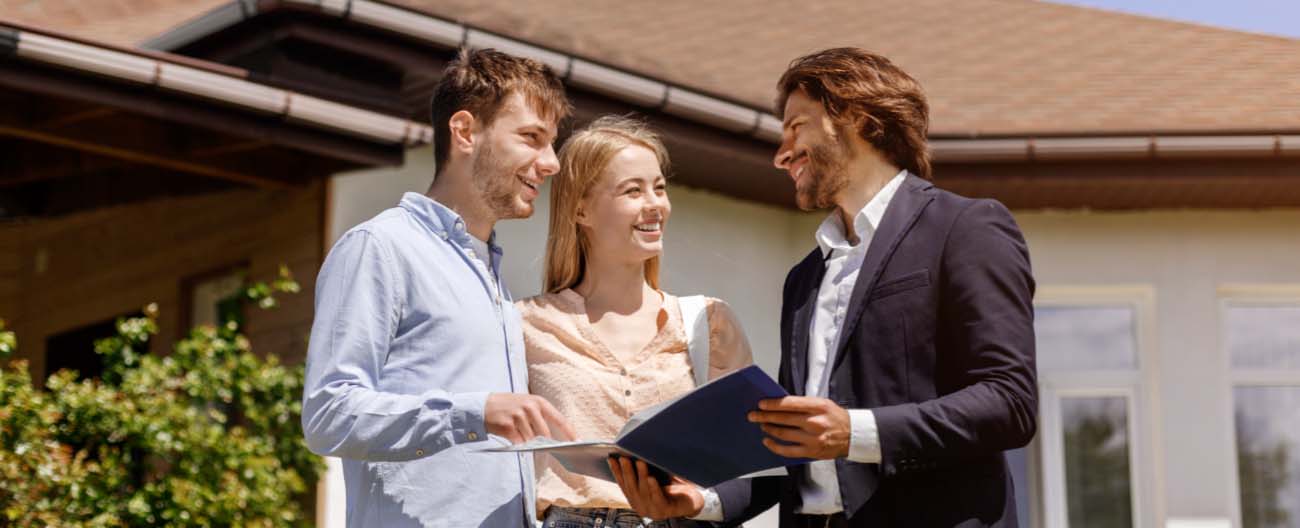 A couple talking to an agent