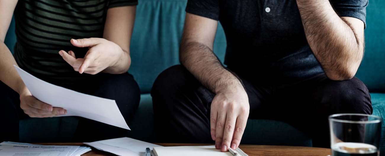 Two people working on some papers.